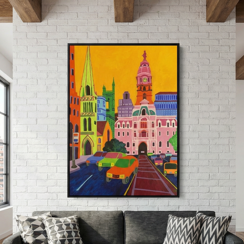 Colorful cityscape painting on a white brick wall above a gray sofa with patterned pillows.