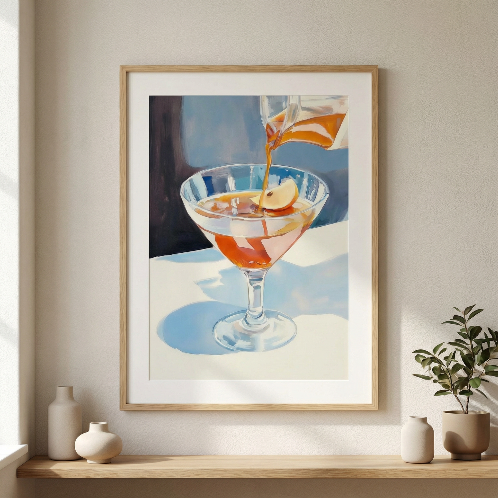 Framed artwork of a cocktail being poured on a shelf with decorative items.
