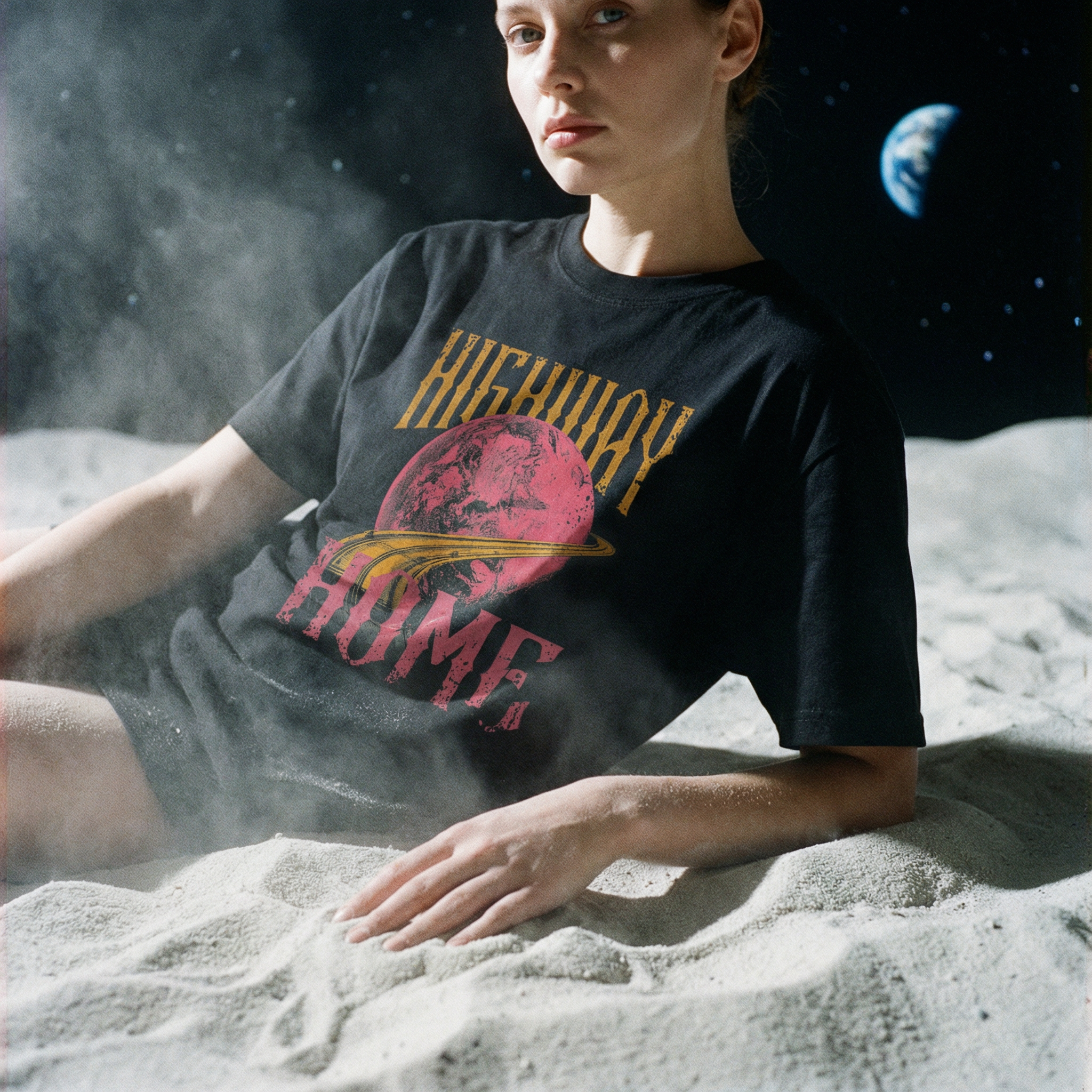 Person on the moon wearing a t-shirt with 'Highway Home' graphic
